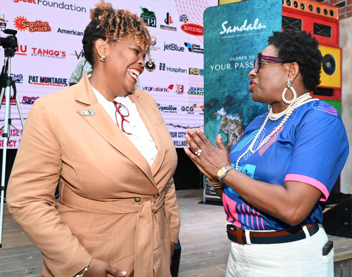 La Sonja Harrison (left), president of the Jamaica Teachers’ Association, chats with Janet Silvera, chairman of the Jill Stewart MoBay City Run, following the event.
