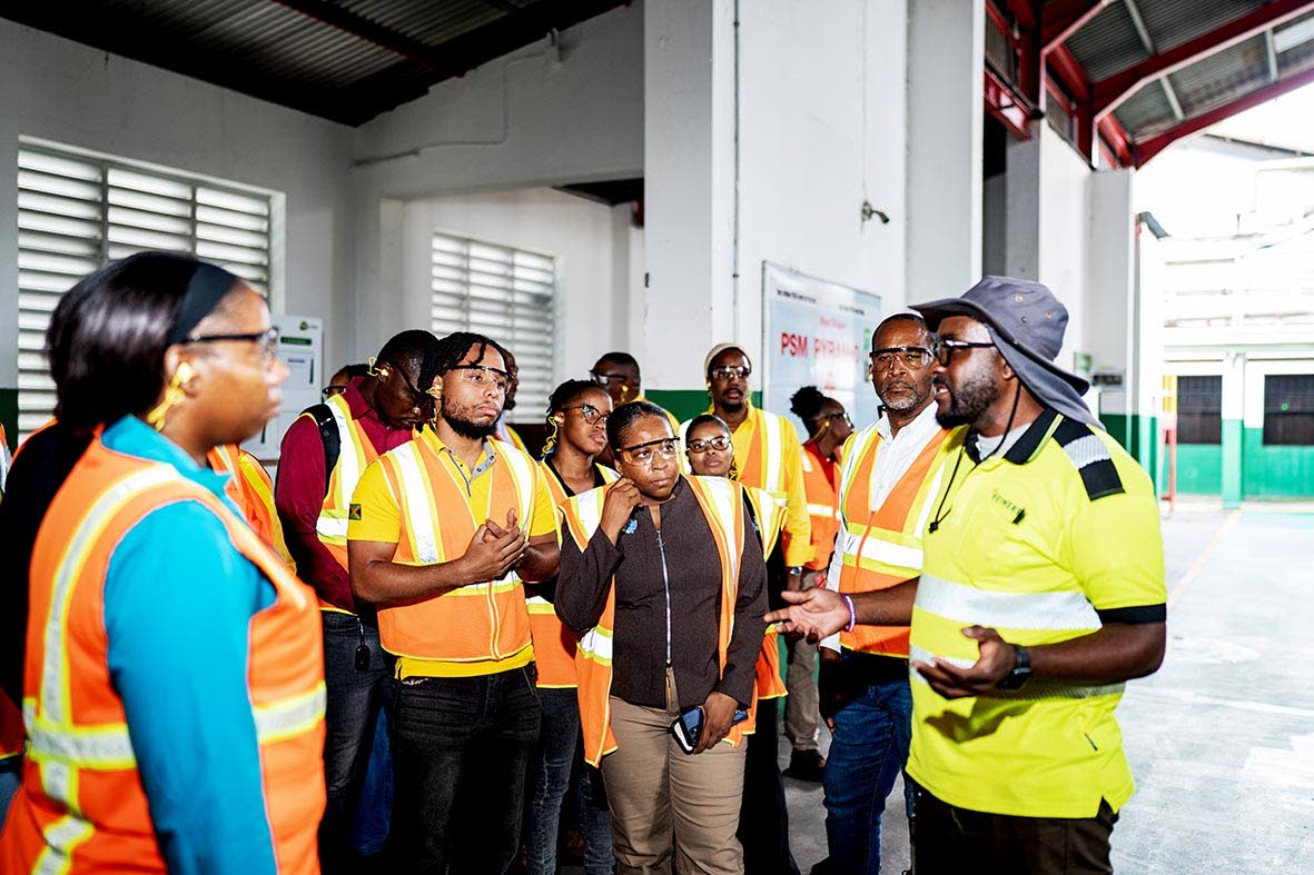 Zitroy Brown, utilities manager at Red Stripe (far right), speaks with HEART/NSTA Trust participants during a tour of the brewery highlighting the company’s reliance on automation and the need to prepare the next generation of technical talent.