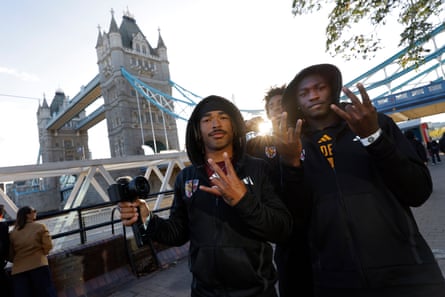 Players perform their famous “Forks Up” hand gesture.