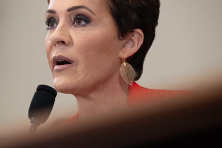 a woman in front of a microphone