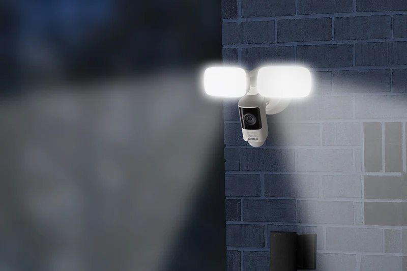 Lorex floodlight shining on a brick wall.