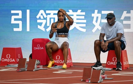 Sha’Carri Richardson talks with her coach, Dennis Mitchell, during a training session ahead of the Xiamen Diamond League meeting in China in May.