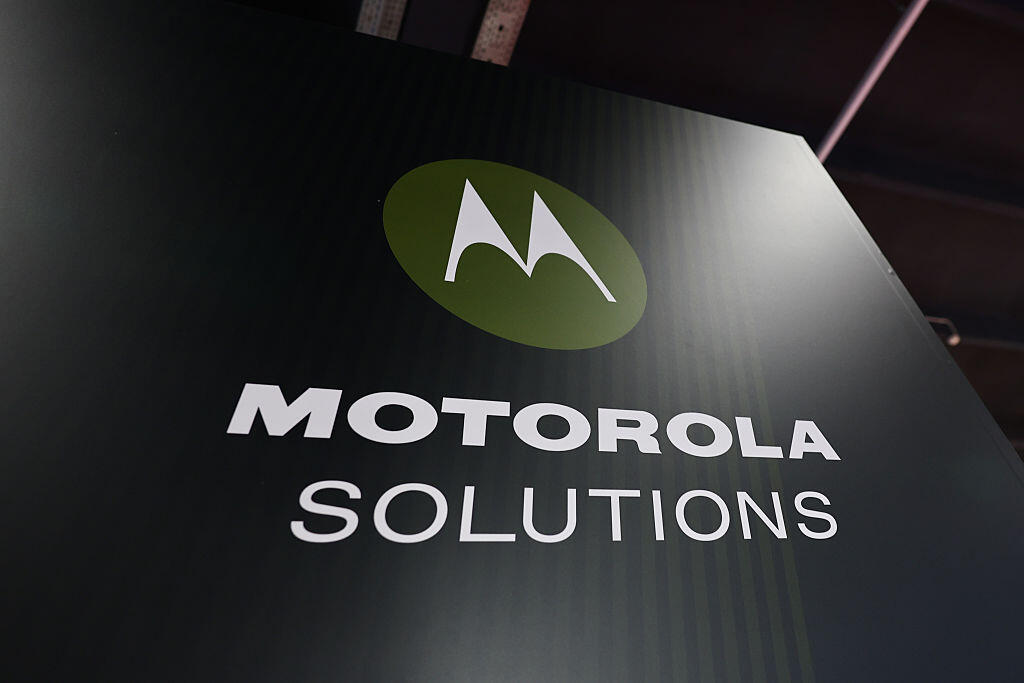 A large Motorola Solutions sign, in dark gray and green.